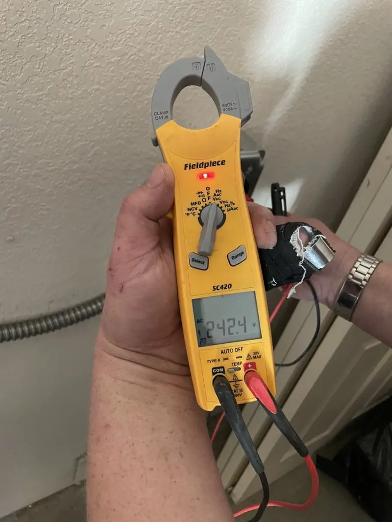 Voltage testing with clamp meter during Outlet Installation in Siler City